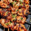 Bang Bang Chicken Skewers served on a platter with dipping sauce