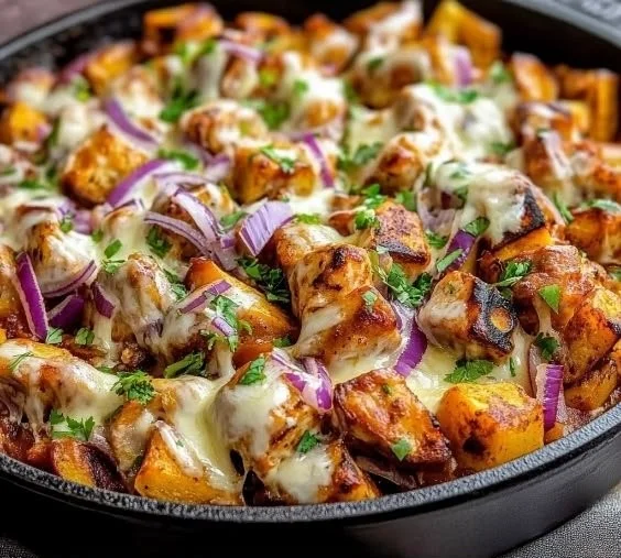 BBQ chicken sweet potato skillet topped with fresh herbs and spices