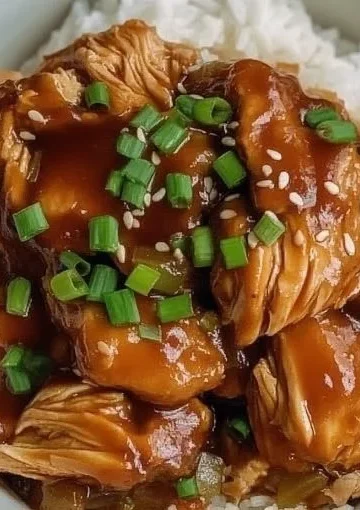 Delicious Crock Pot Huli Huli Chicken served on a plate with pineapple garnish.