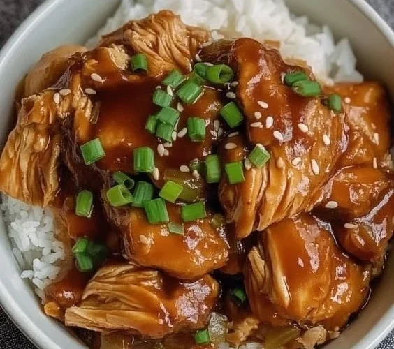 Delicious Crock Pot Huli Huli Chicken served on a plate with pineapple garnish.
