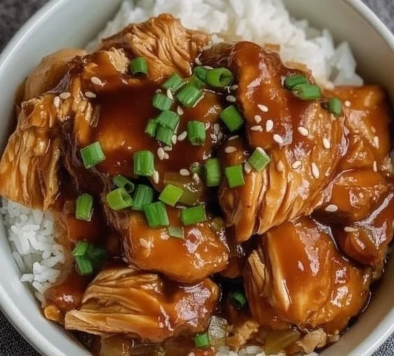 Delicious Crock Pot Huli Huli Chicken served on a plate with pineapple garnish.