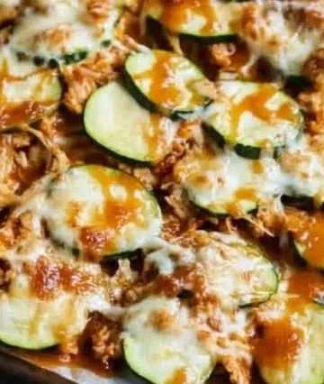 Cheesy BBQ Chicken Zucchini Nachos topped with fresh ingredients