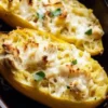 Healthy Chicken Alfredo Spaghetti Squash Boats recipe with creamy sauce and chicken