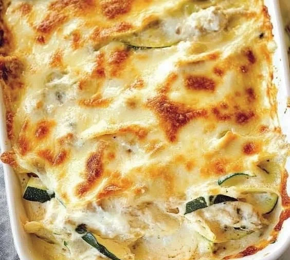 Delicious Chicken Alfredo Zucchini Lasagna topped with creamy sauce and cheese.