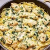 Creamy Chicken and Spinach Spaghetti Squash Alfredo dish garnished with parsley