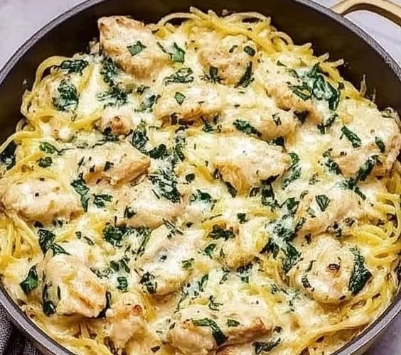 Creamy Chicken and Spinach Spaghetti Squash Alfredo dish garnished with parsley