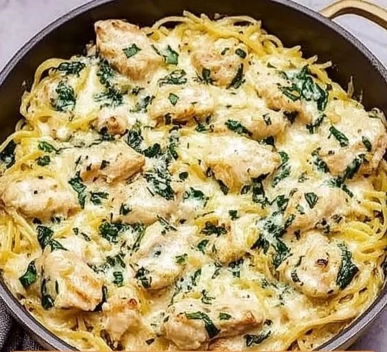 Creamy Chicken and Spinach Spaghetti Squash Alfredo dish garnished with parsley