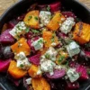 Creamy roasted beet salad with greens and a flavorful dressing