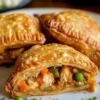 Fried chicken pot pie pockets with flaky crust and savory filling