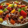 Healthy beef and pepper rice bowl with colorful vegetables and rice