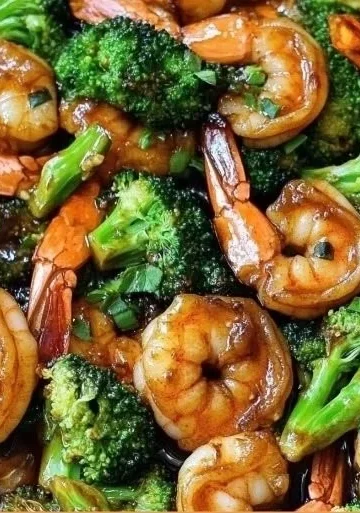 Honey Garlic Butter Shrimp served with fresh broccoli in a savory sauce.