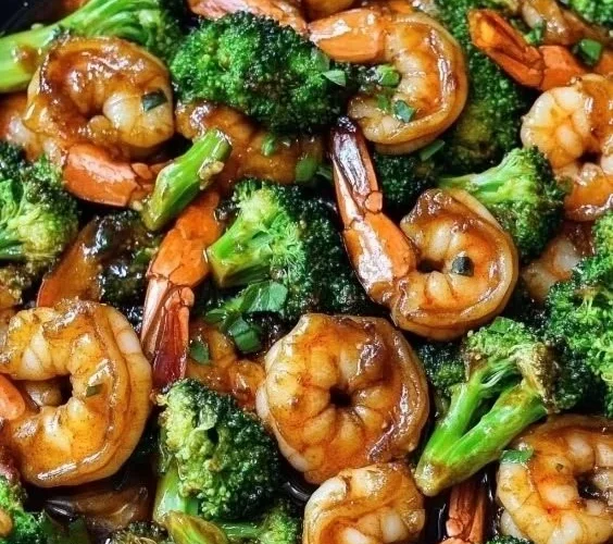 Honey Garlic Butter Shrimp served with fresh broccoli in a savory sauce.