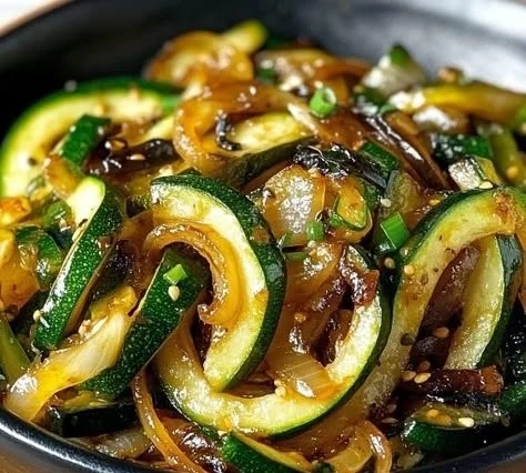Delicious Japanese Zucchini and Onion Stir-Fry served in a bowl
