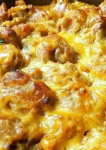 Delicious baked Portuguese chicken rice served in a bowl with vibrant colors.