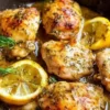 Paleo Lemon Dill Chicken served on a plate with fresh herbs