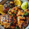 Deliciously glazed grilled chicken served on a plate, ready to enjoy.