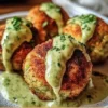 Delicious salmon balls served with creamy avocado sauce on a plate