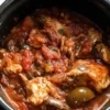 Delicious slow cooker chicken cacciatore served with vegetables and herbs