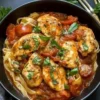 Slow Cooker Tomato Basil Chicken served on a plate with fresh basil garnish.