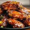 Sticky orange chicken wings glazed with a sweet and tangy orange sauce