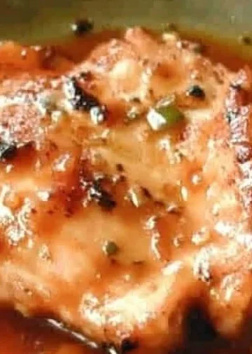 Delicious Sweet Baby Ray's Crockpot Chicken served in a bowl with garnish