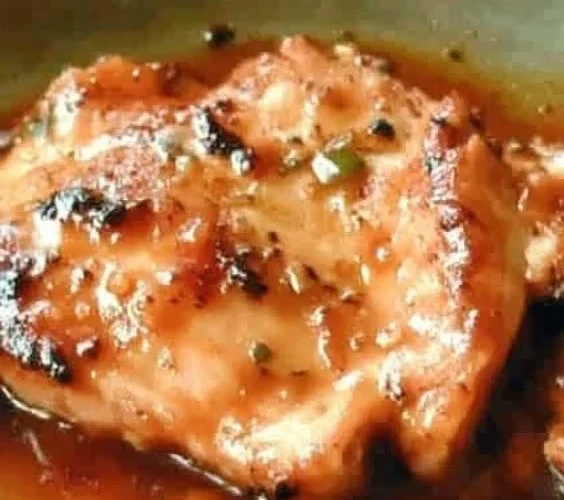 Delicious Sweet Baby Ray's Crockpot Chicken served in a bowl with garnish