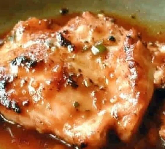 Delicious Sweet Baby Ray's Crockpot Chicken served in a bowl with garnish