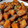 Delicious sweet and spicy smashed sweet potatoes served in a bowl.