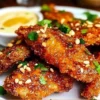 Delicious Thai Sticky Chicken Fingers with a rich glaze on a plate.