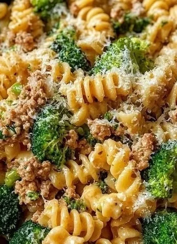 Broccoli Ground Turkey Alfredo Pasta topped with creamy sauce and fresh broccoli