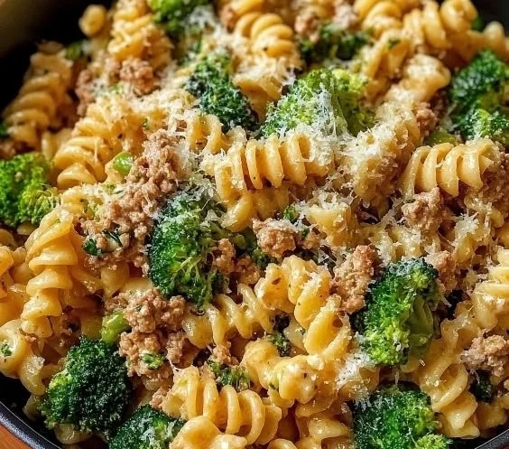 Broccoli Ground Turkey Alfredo Pasta topped with creamy sauce and fresh broccoli
