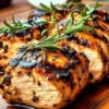 Delicious balsamic grilled chicken served on a plate with fresh vegetables