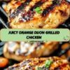 Juicy orange dijon grilled chicken on a plate with herbs and citrus slices