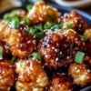 Korean Baked Cauliflower dish garnished with sesame seeds and green onions