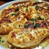 Delicious Parmesan Chicken dish served with herbs and spices