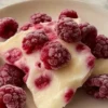 Raspberry Yogurt Bites served in a bowl with fresh raspberries