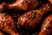 Slow Cooker Asian Glazed Chicken Drumsticks garnished with sesame seeds and green onions