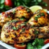 Spicy Calabrian chili roasted chicken garnished with fresh herbs