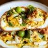 Spicy and crispy egg salad served in a bowl with fresh ingredients