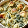 Creamy spinach artichoke chicken with cottage cheese served on a plate.