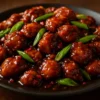 Delicious plate of Sweet Savory Mongolian Chicken garnished with green onions.
