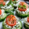 Zesty cucumber cottage cheese bites served on a platter with herbs