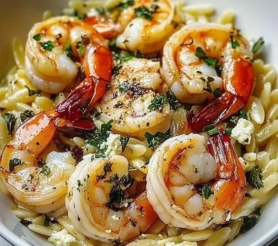 Delicious Lemon Feta Orzo with shrimp served in a vibrant dish.