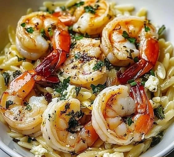 Delicious Lemon Feta Orzo with shrimp served in a vibrant dish.