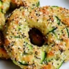 Freshly baked zucchini bagels with a golden crust and veggie filling